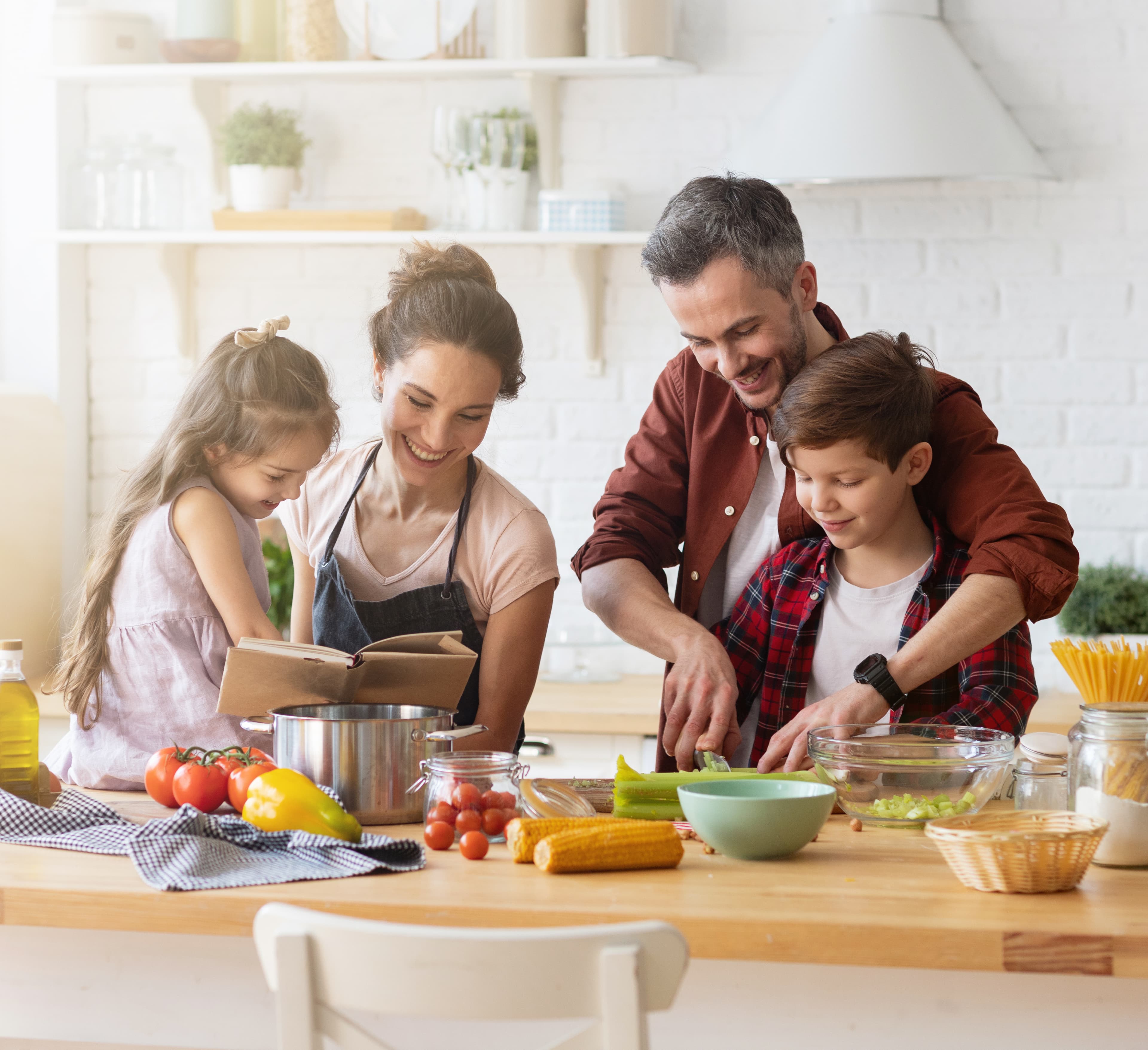 People cooking together in a warm kitchen